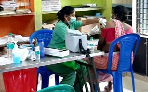 Nurse giving someone a vaccine