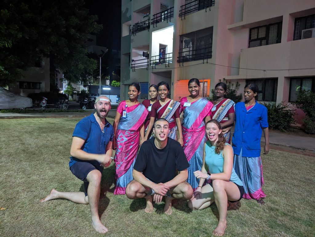 Luke, Sorush, and Lhotse pose with the staff from Aravind Eye Hopital after playing spikeball.